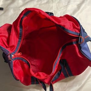 Small red duffel bag